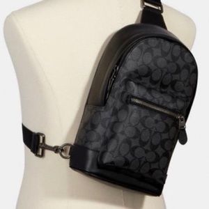 Black and grey coach backpack